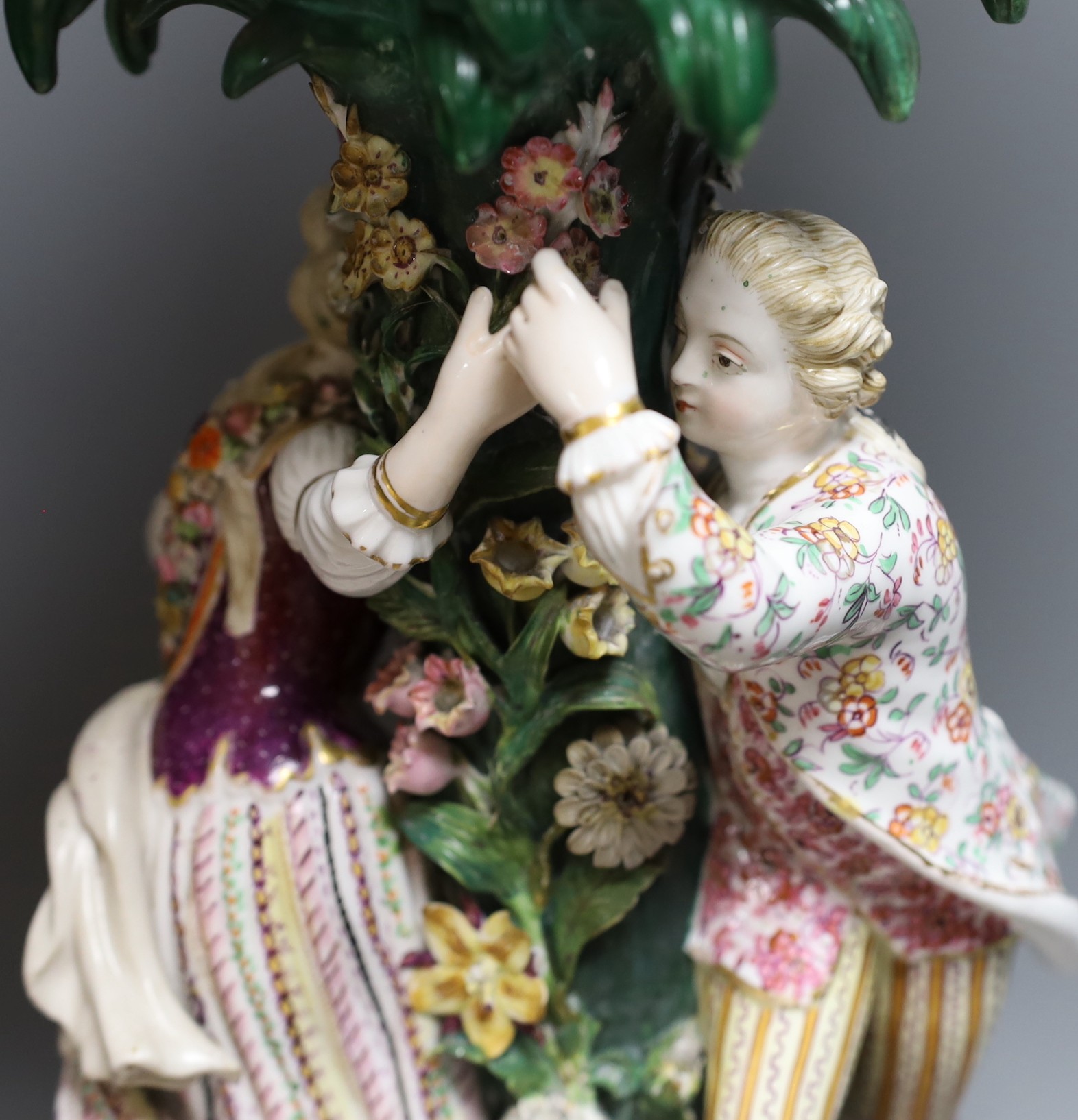 A 19th century Dresden floral encrusted centrepiece and two other continental porcelain centrepieces, tallest 46cm